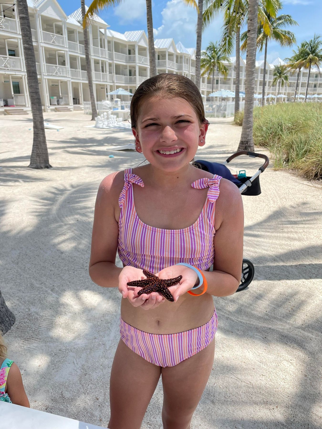 Guest holding a sea star during a marine encounter